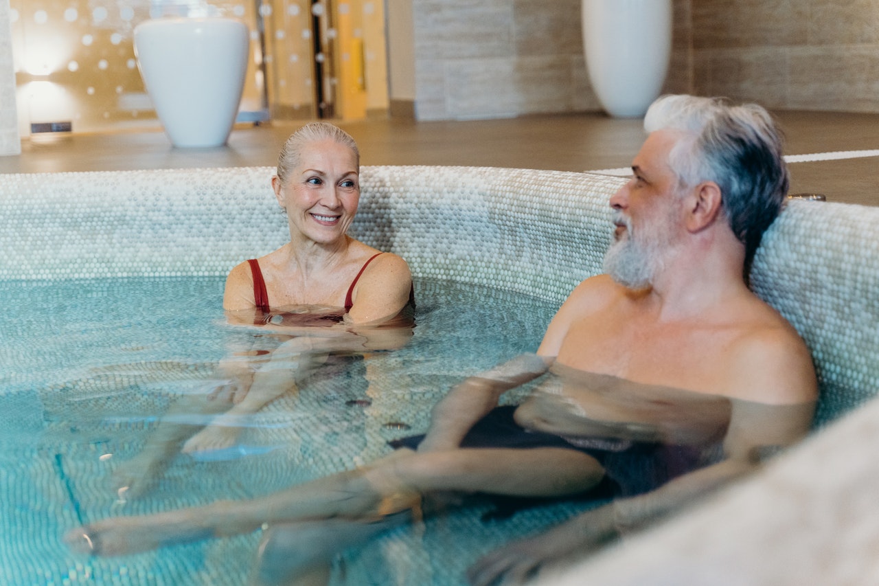 A couple relaxing in a pool