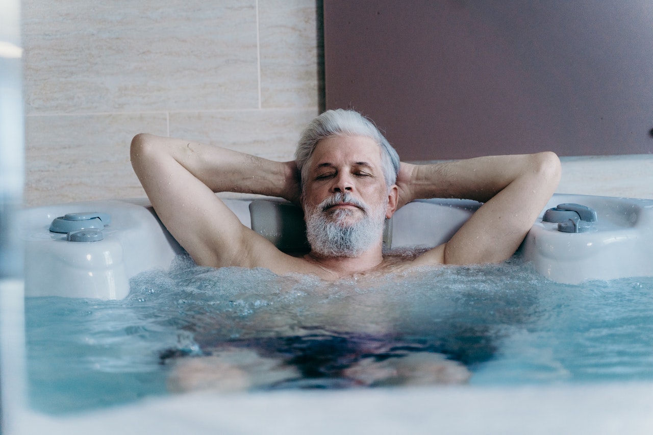 Man relaxing in hot tub